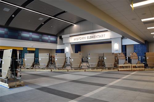 another view inside cafeteria showing the opposite wall with Midtown Elementary sign above it